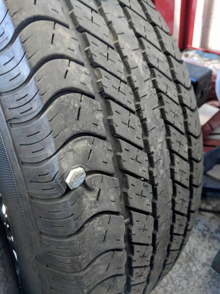 Nail punctured tire and needs replacing